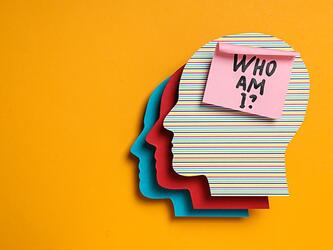 three overlaying graphics of a head silhouette topped with post-it note that says 'who am I?'